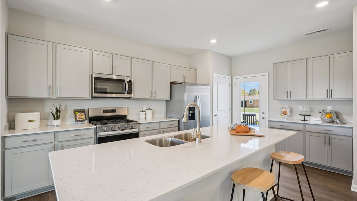 kitchen cabinets galore and quartz countertops