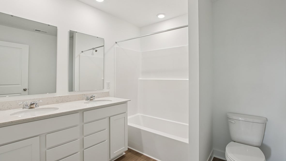 bathroom with dual vanity