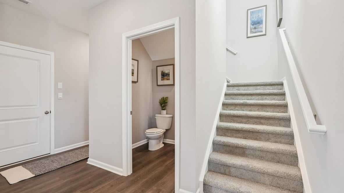 half bathroom and stairs to upper level