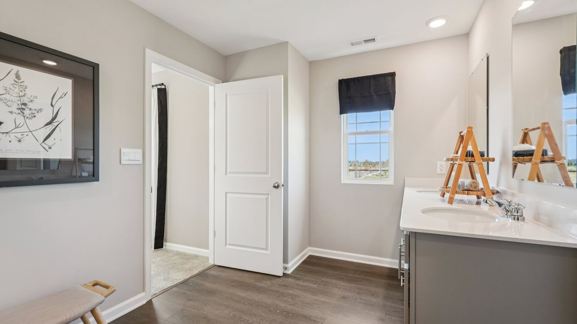 primary bathroom with dual sinks