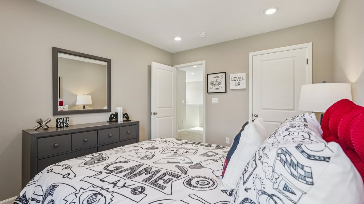 bedroom with full size bed and dresser