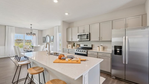 kitchen with seating for three at the island