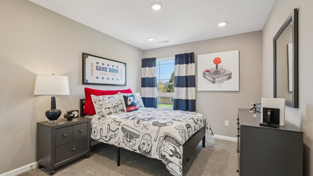 bedroom 4 with window overlooking rear yard