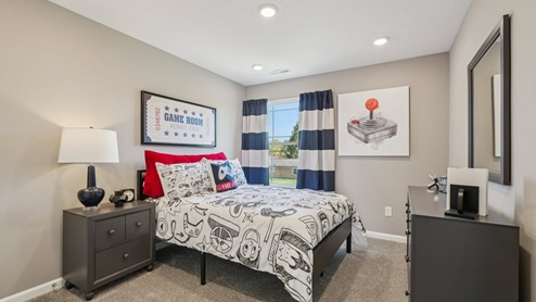 bedroom 4 with window overlooking rear yard