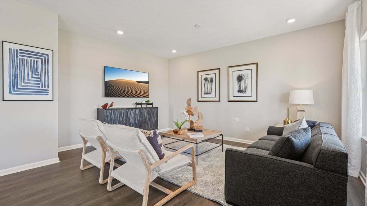 great room with couch and two chairs