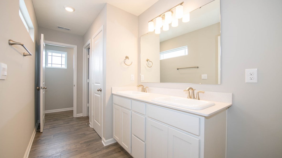 primary bathroom quartz counters and dual sinks