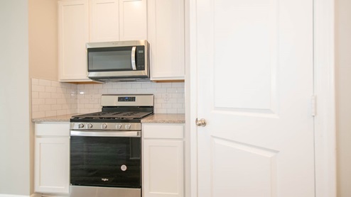 kitchen pantry and cooktop area