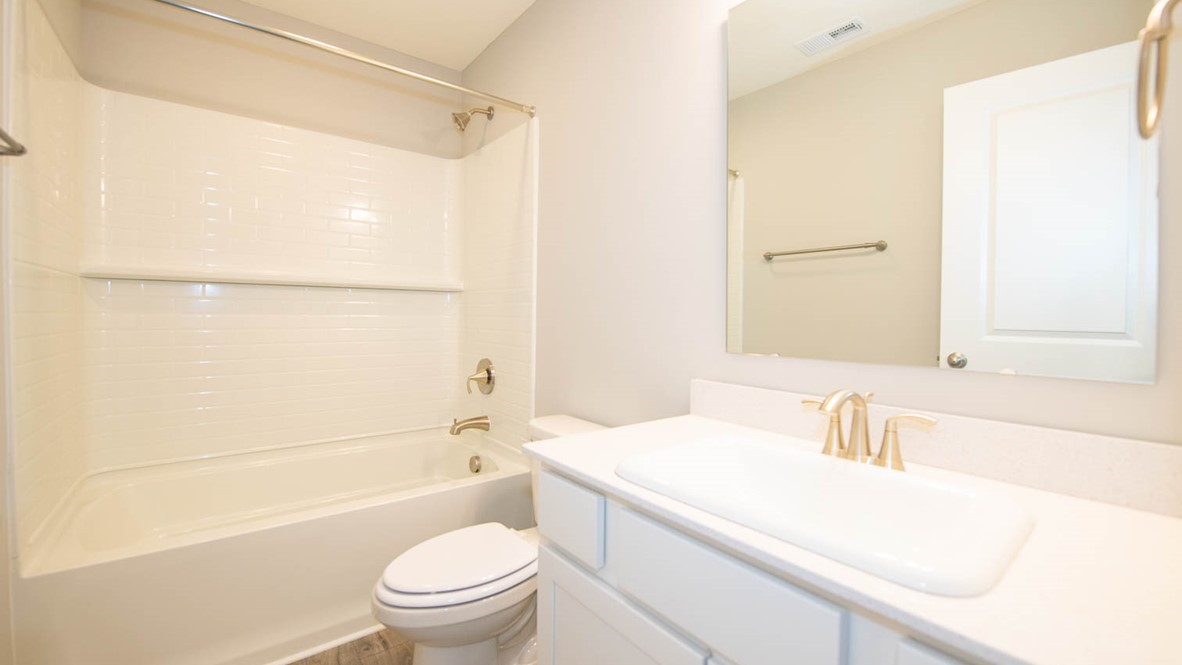 hall bathroom with tub shower