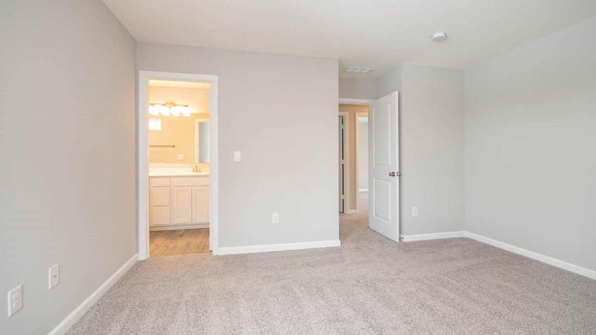 primary bedroom with ensuite bathroom