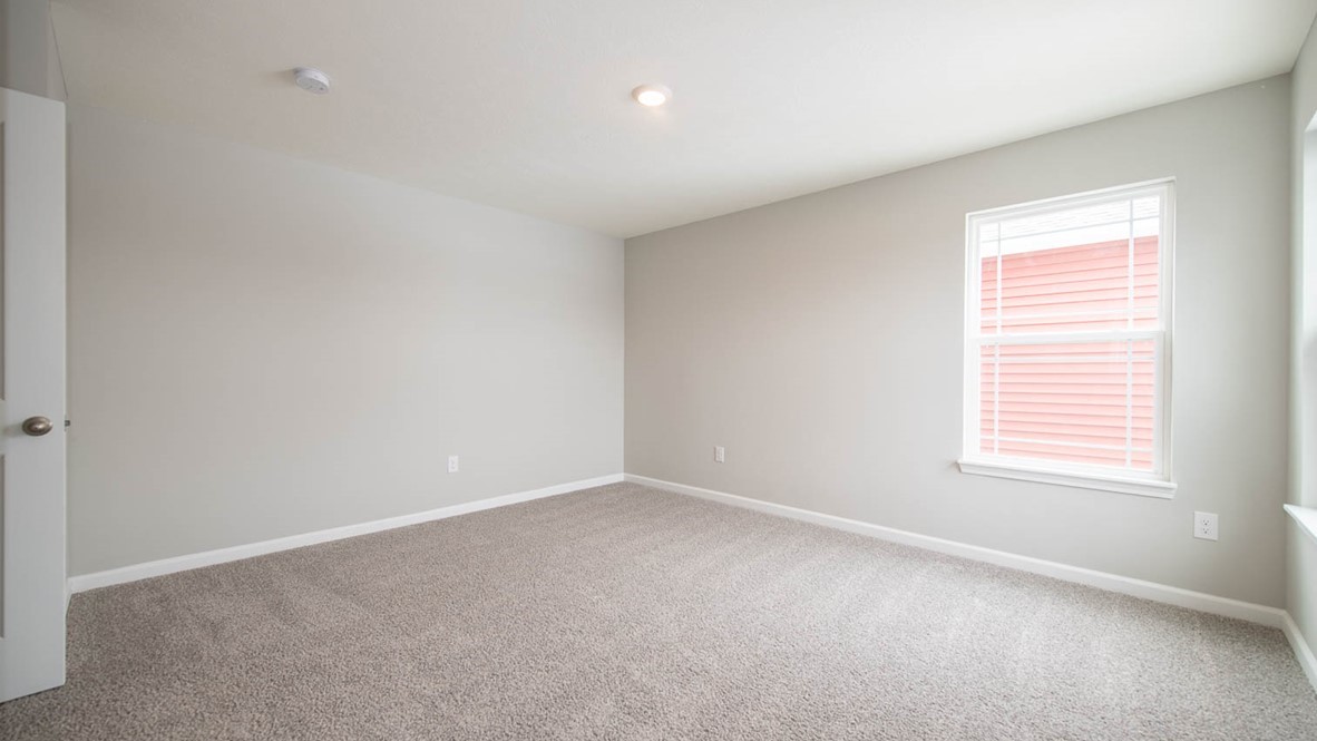 primary bedroom overlooks the back yard