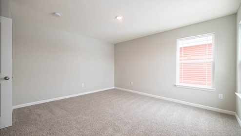 primary bedroom overlooks the back yard