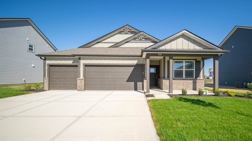 single story ranch with 3-car garage and brown color scheme