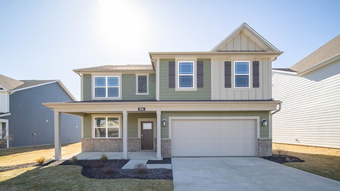 two story home with craftsman style color scheme
