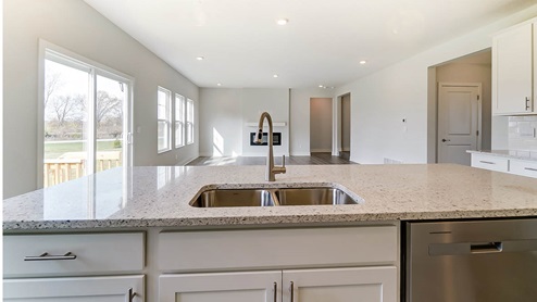 Kitchen with white cabinets and nickel hardware