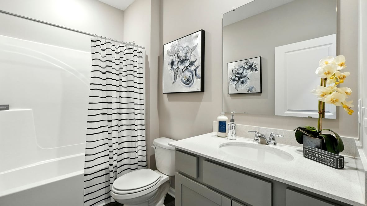 bathroom with shower and tub