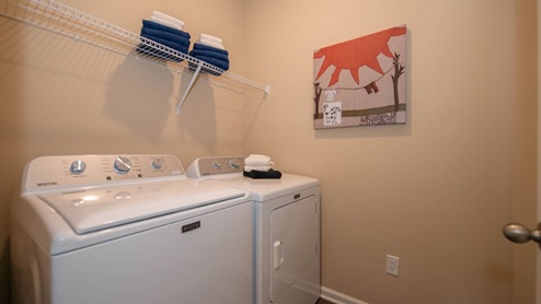 Nicely situated laundry room just off the garage entrance