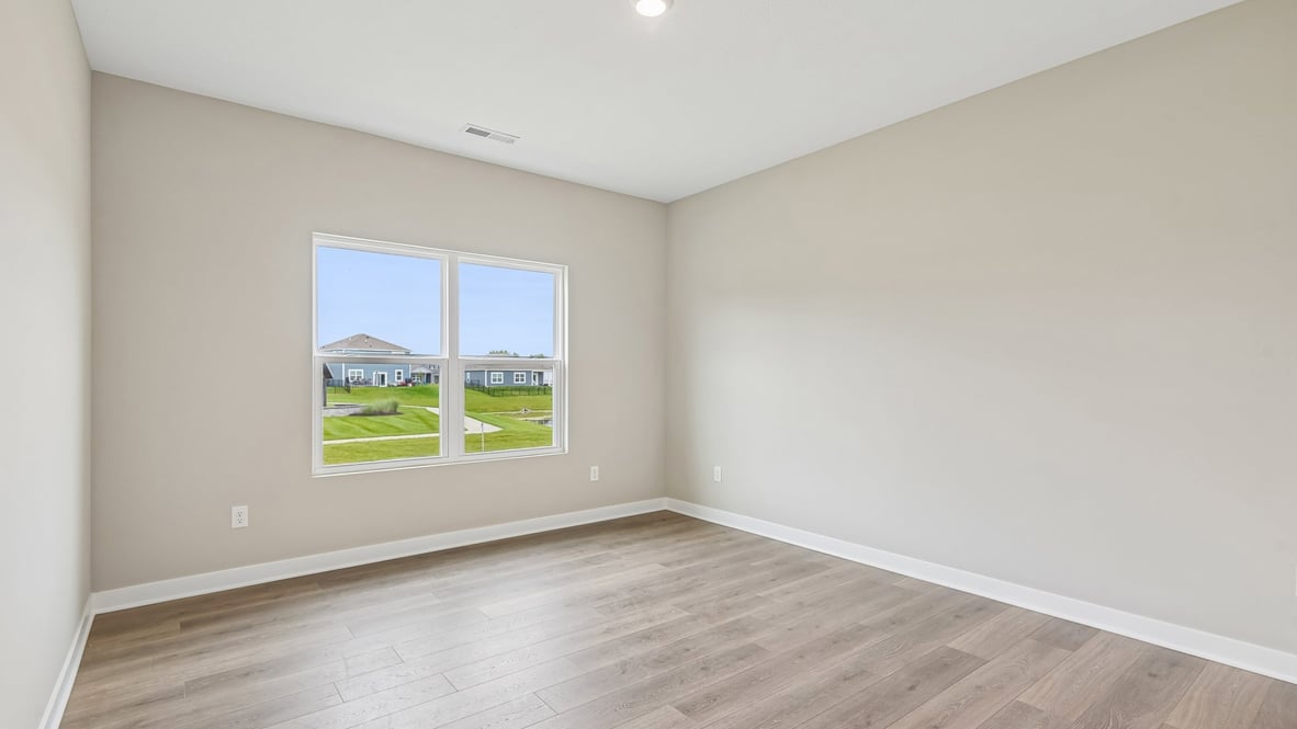 primary bedroom with large windows