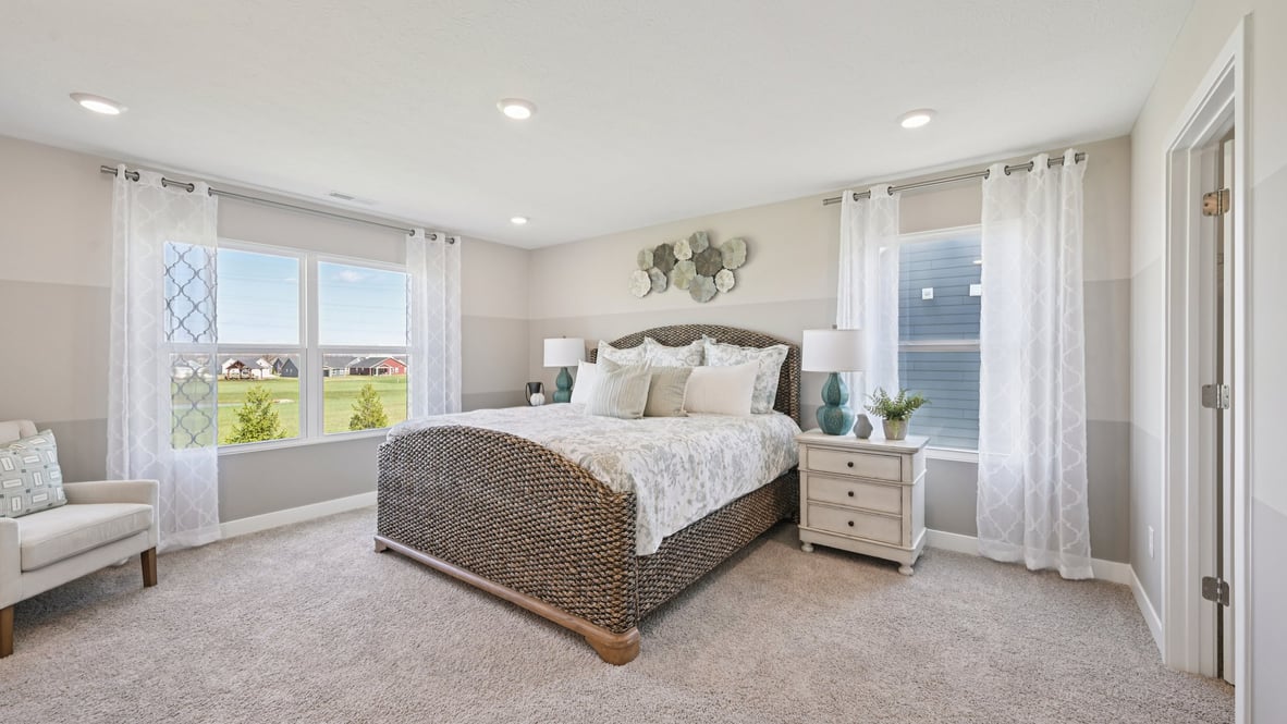 primary bedroom with large windows