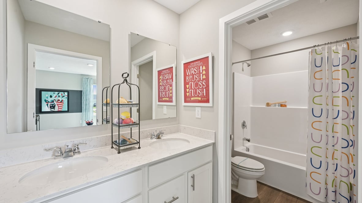 bathroom with dual vanity