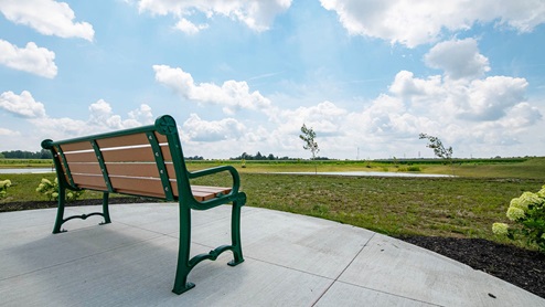 walk along the community trails or sit down on a bench to enjoy a summer breeze