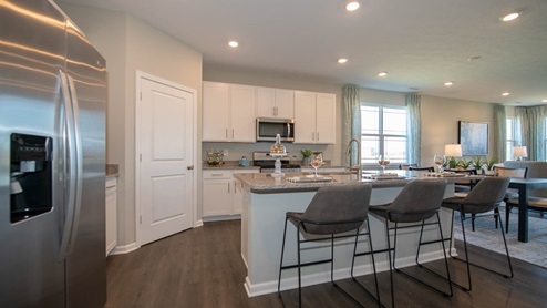 kitchen with white cabinets and island