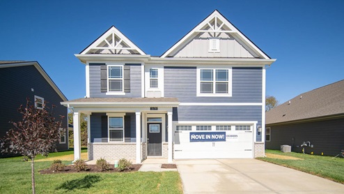 two story home with blue siding