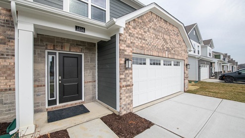 2 story brick home homes for sale fortville indiana real estate mt. vernon schools 4 bedroom 2.5 baths den study home office living room family room kitchen island quartz countertops tiled shower garden tub walk in closets out door patio
