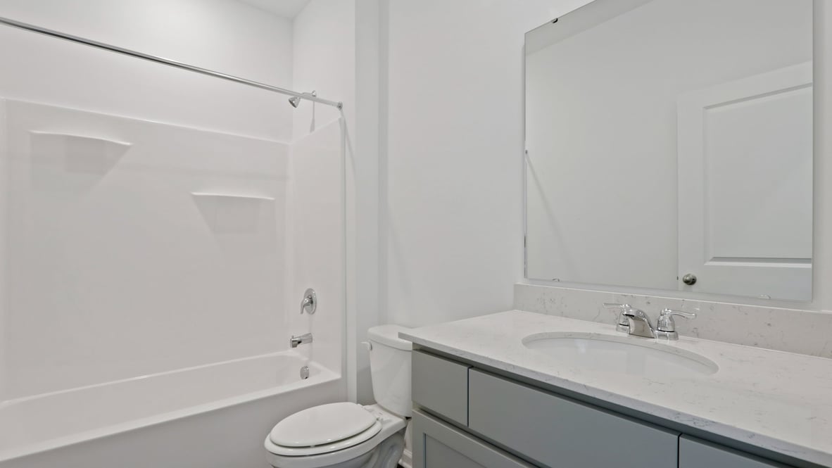 hall bathroom with tub shower