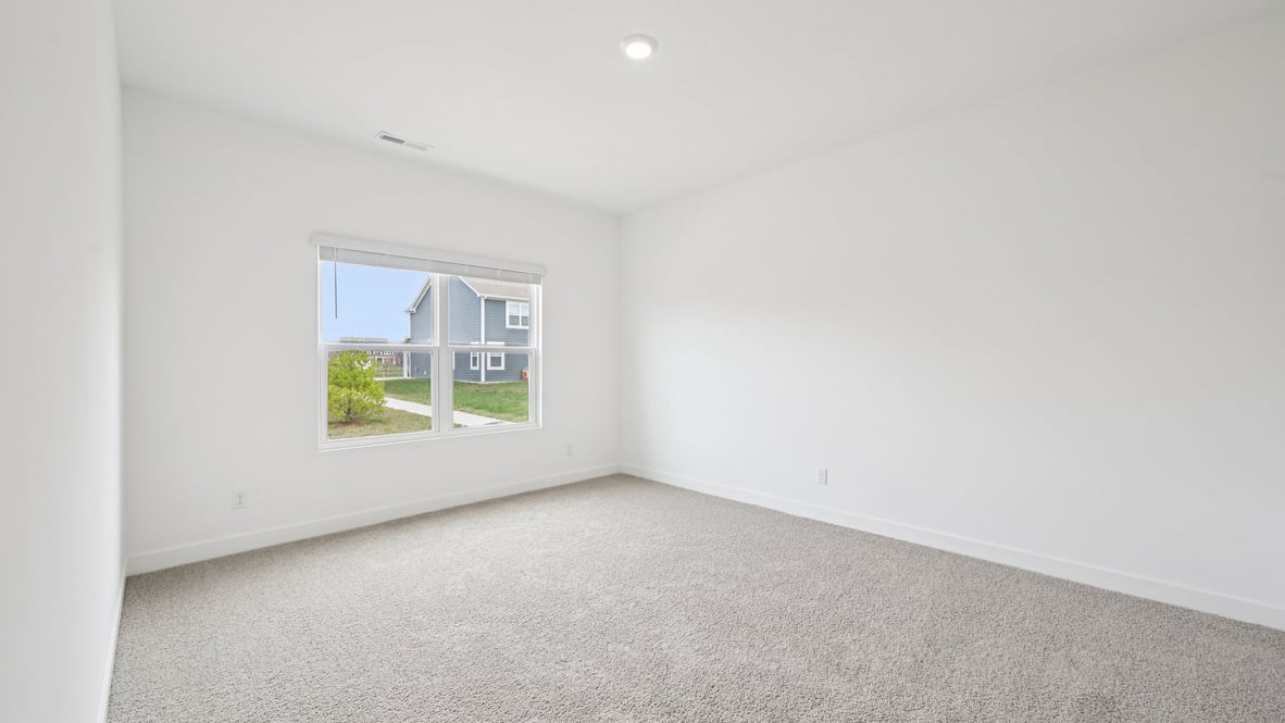 primary bedroom with large windows