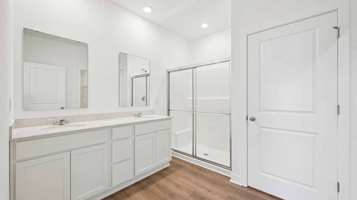 primary bathroom with dual vanity