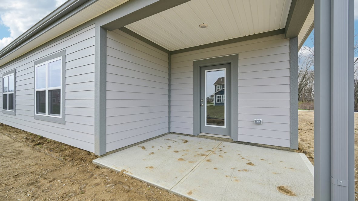 covered patio on the back of the home
