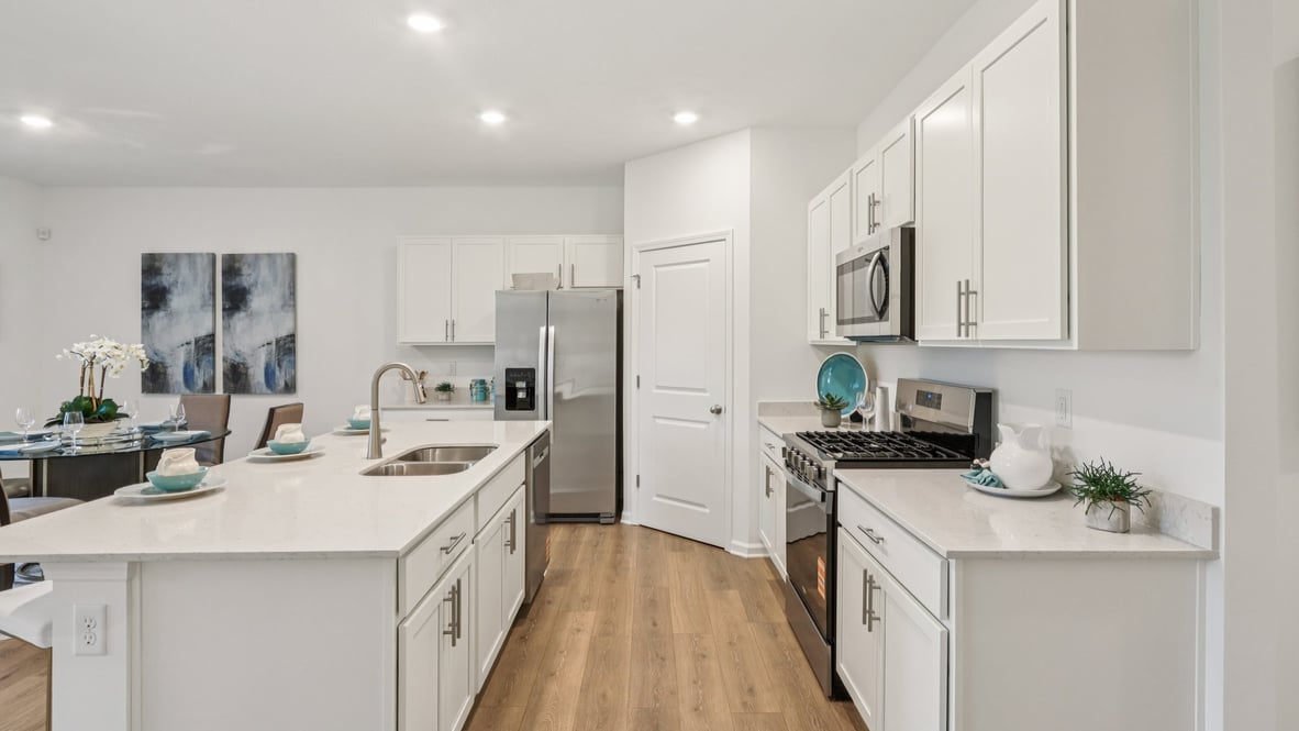 kitchen with quartz counters and corner pantry