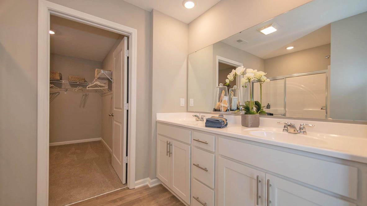 The primary bathroom offers dual sinks