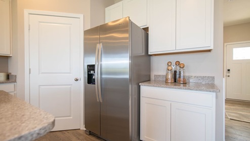 A walk-in pantry offers storage galore