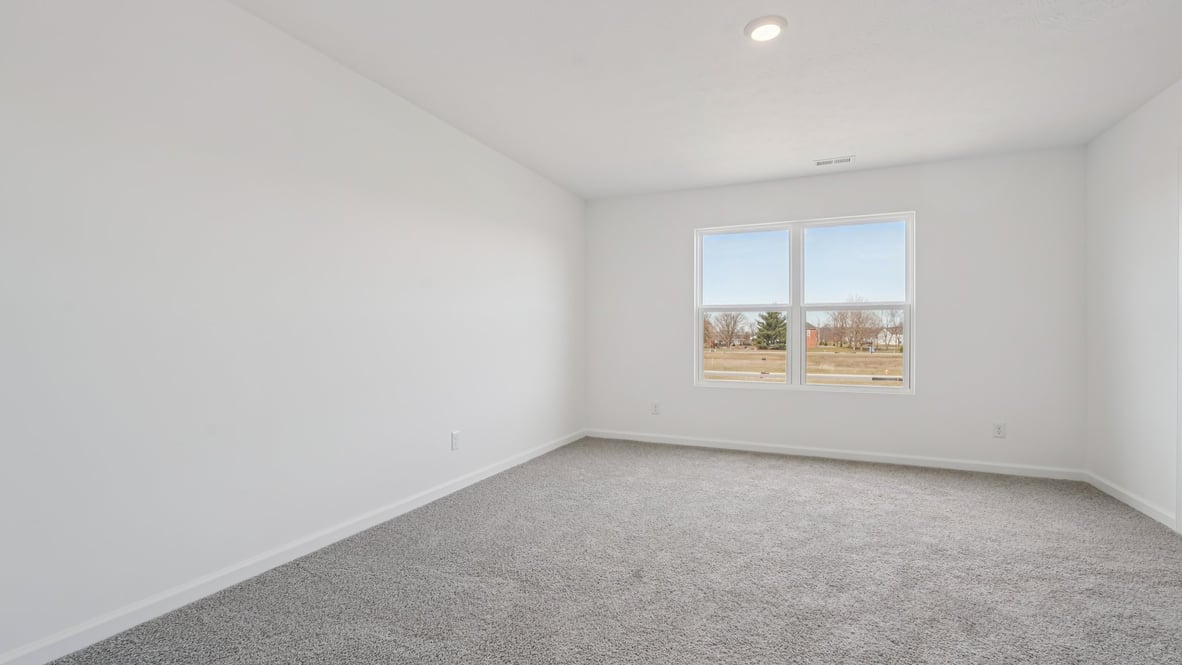 primary bedroom with large windows