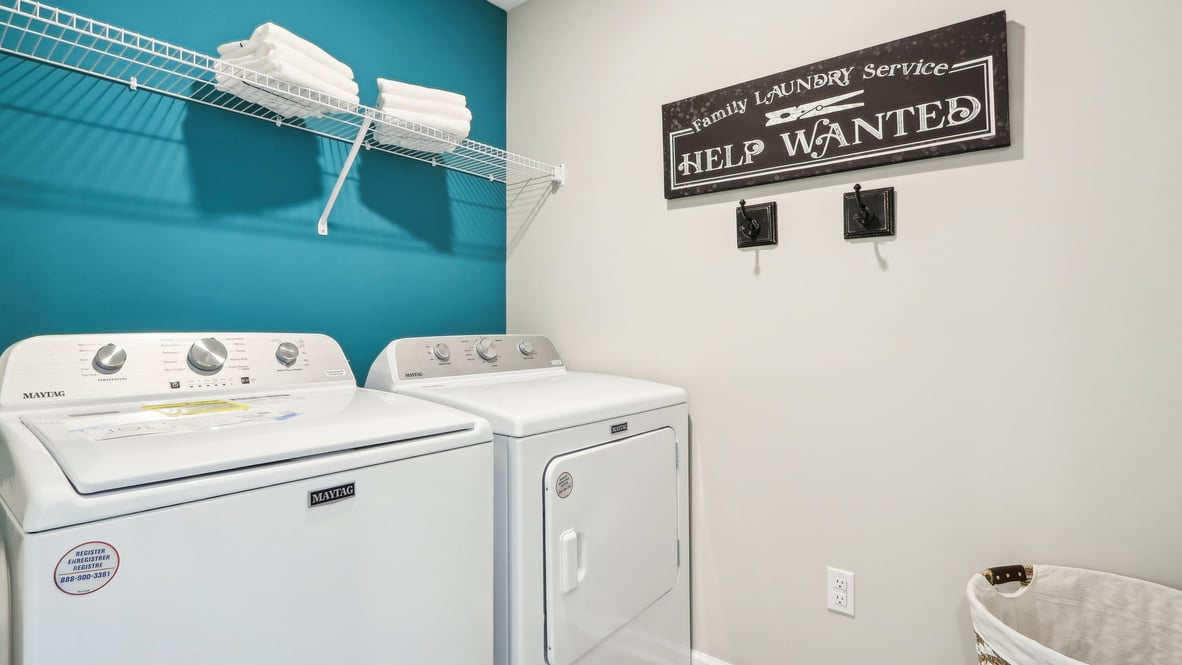 laundry room with washer dryer and shelving