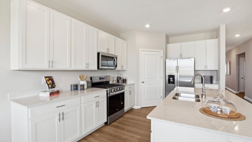 kitchen with large corner pantry