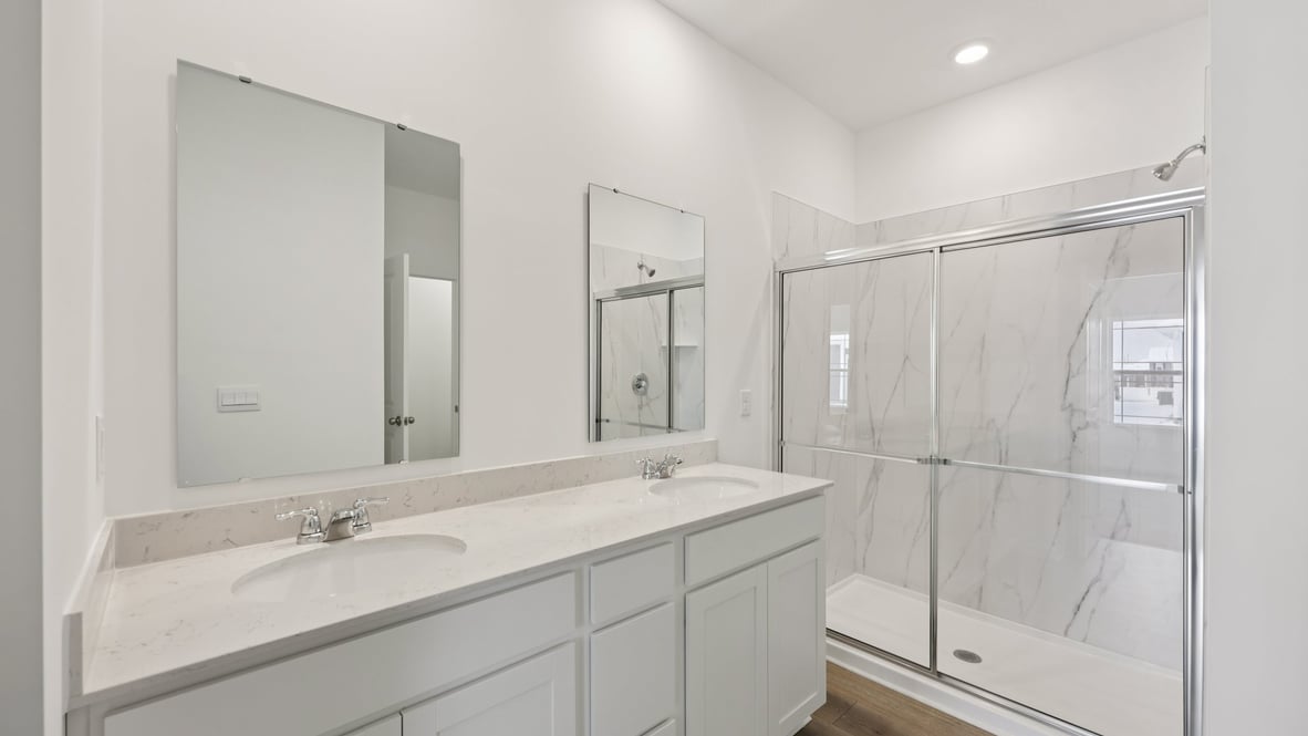 Owner’s ensuite view in our new build home offers function, style, a walk-in closet, spa-like ensuite