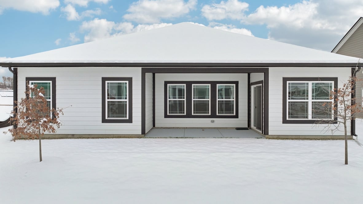 Side yard view showing outdoor space adjacent to the home