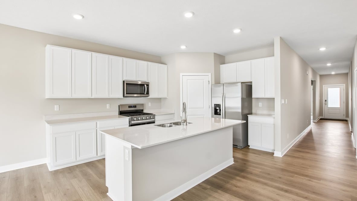 kitchen with white cabinets and quartz counters