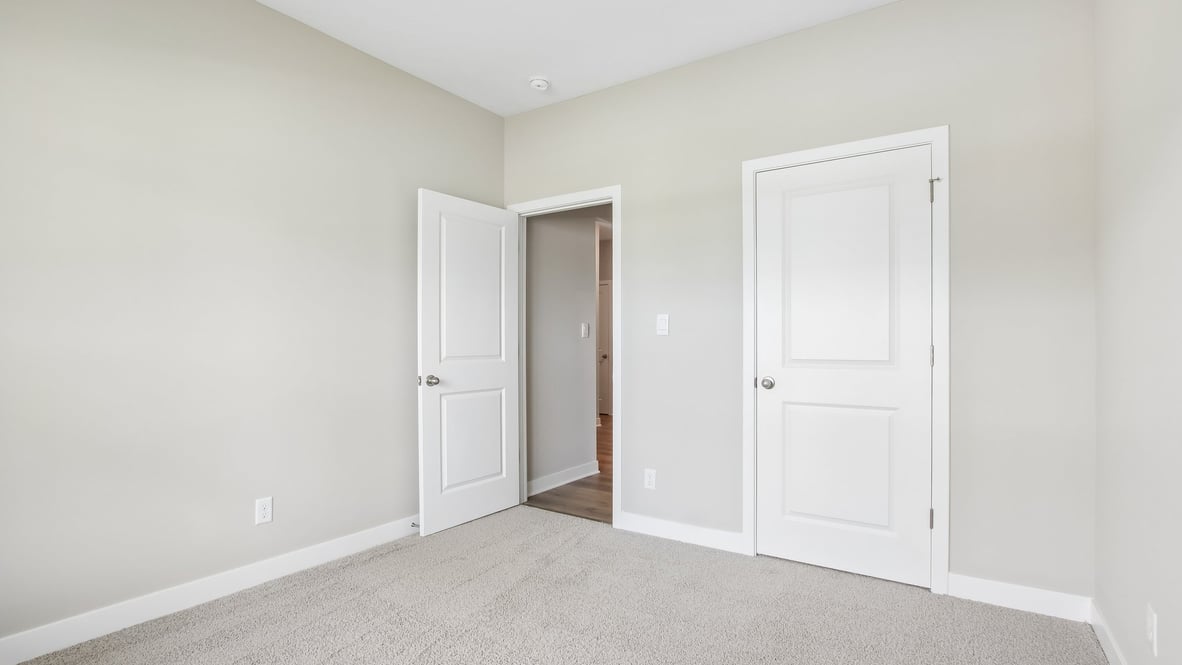 spacious bedroom in front of home