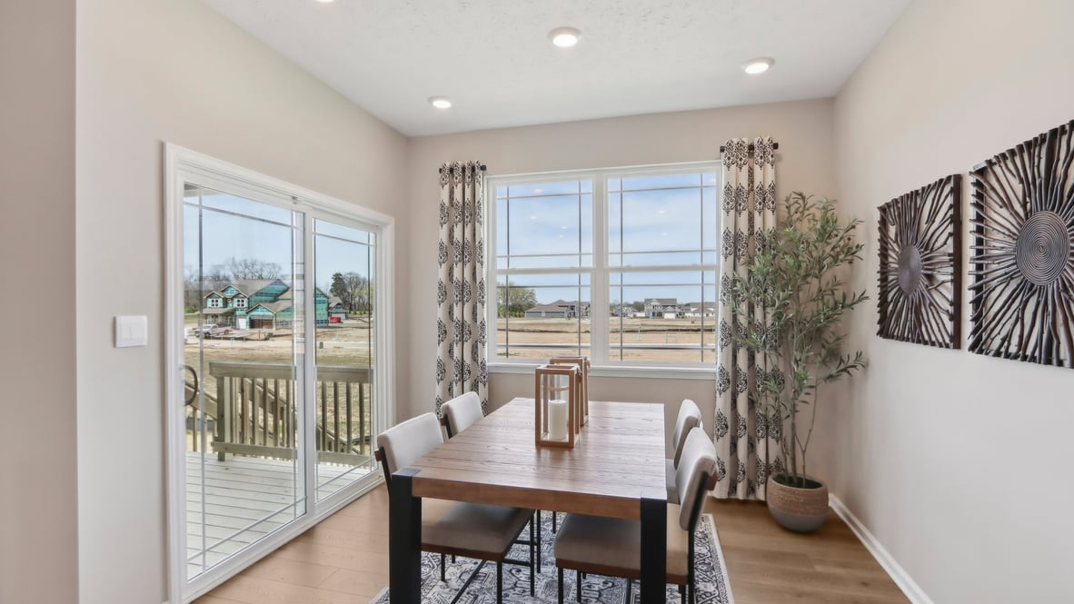 dining nook leading to outdoor patio with natural light