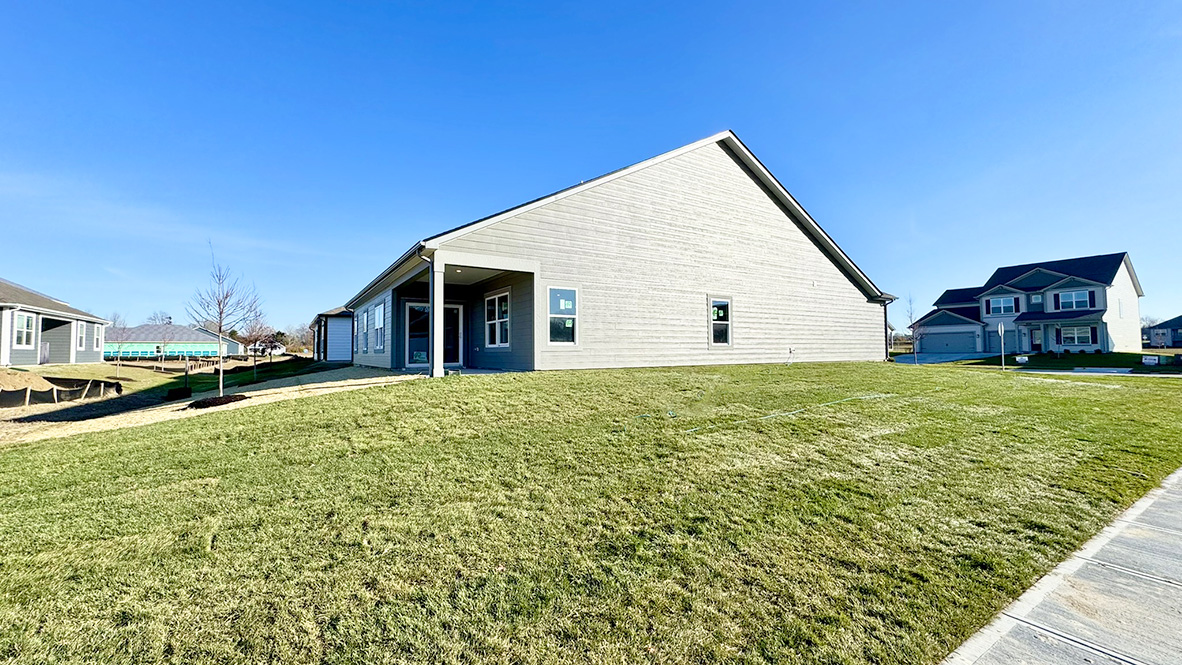 large side yard with covered porch.