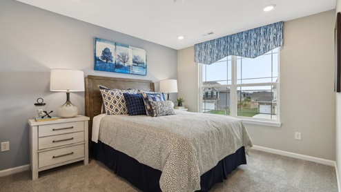 guest bedroom with large windows