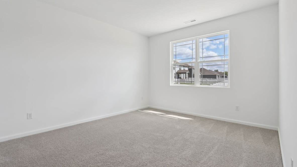 primary bedroom with large windows