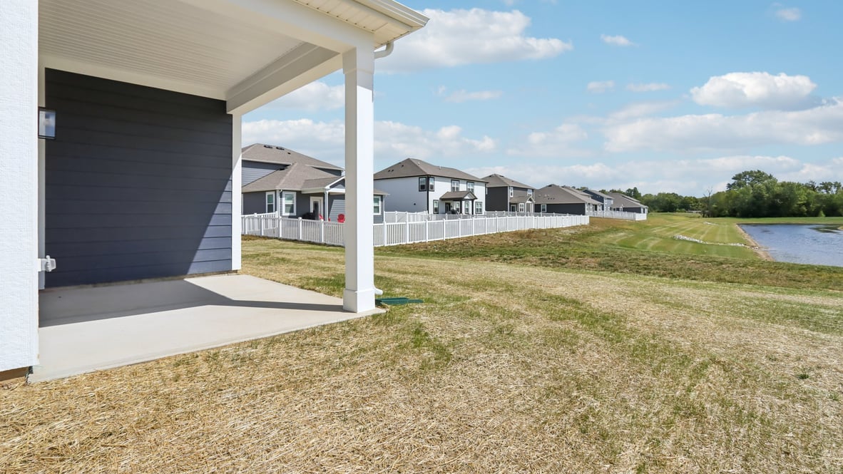 covered patio on the back of the home