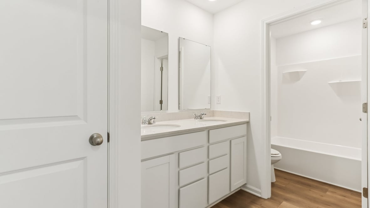 bathroom with shower and tub