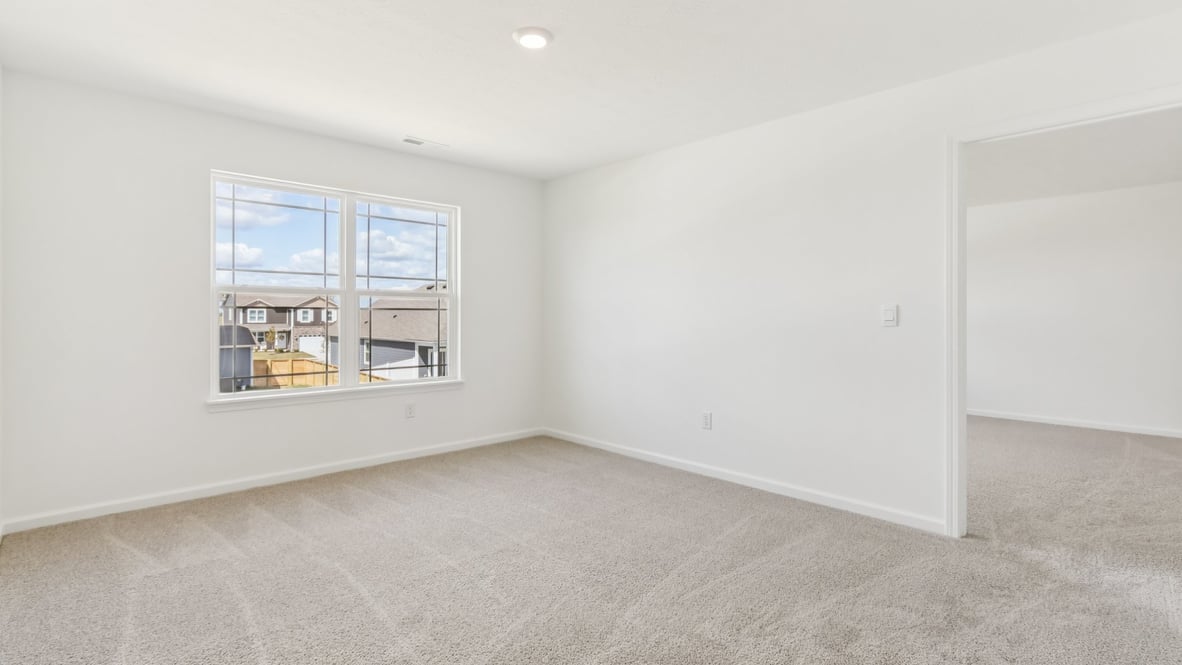 primary bedroom with large windows