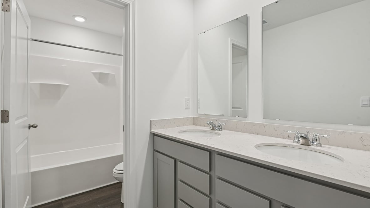 bathroom with dual vanity