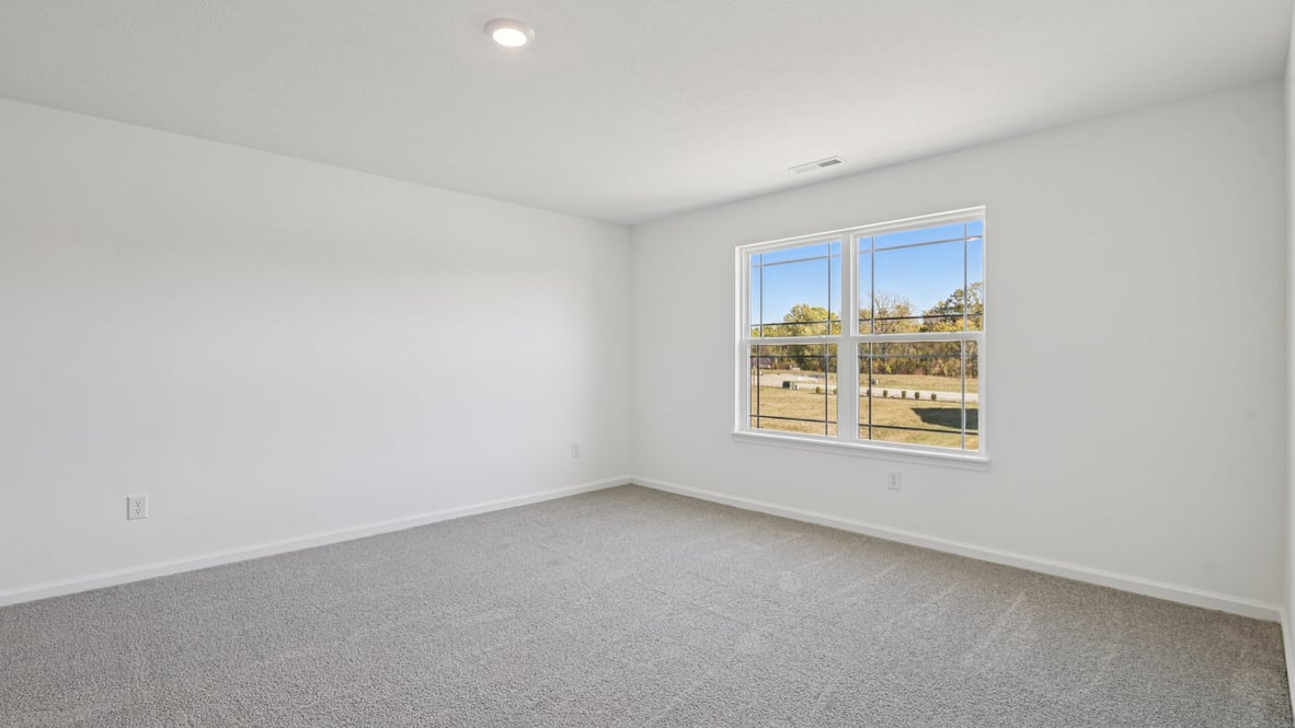 primary bedroom with large windows